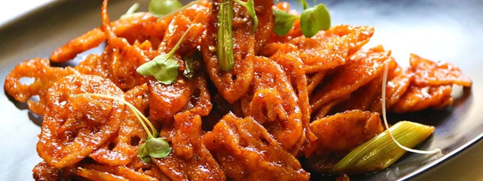 Aglio Olio Lotus Stem: A unique twist on the classic Italian dish, blending crispy lotus stem with garlic and chili flavors.