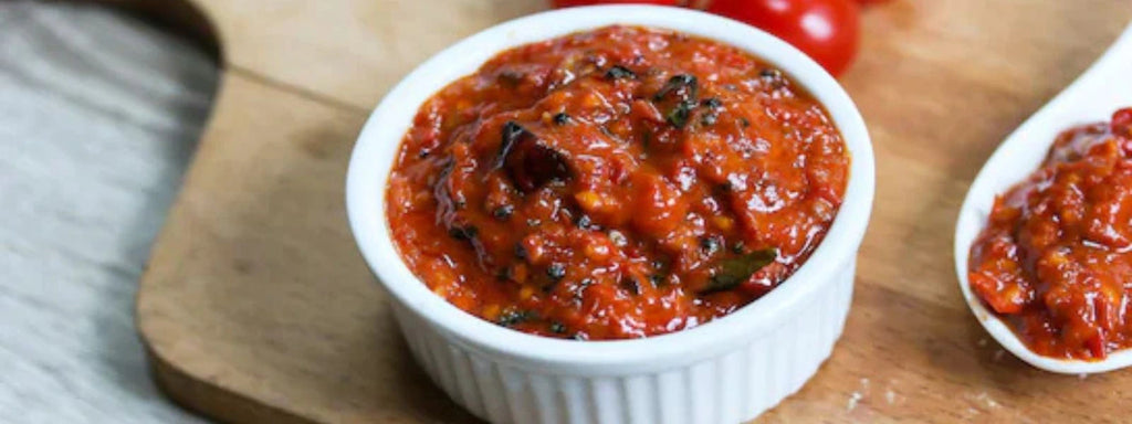 Tomato Bharta: A smoky, rustic mash of roasted tomatoes, garlic, onions, and chilies