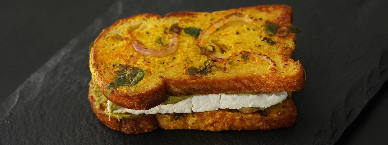 Dahi Tadka Paneer Sandwich: A tangy, spiced curd and paneer sandwich with a sizzling mustard-curry leaf tadka