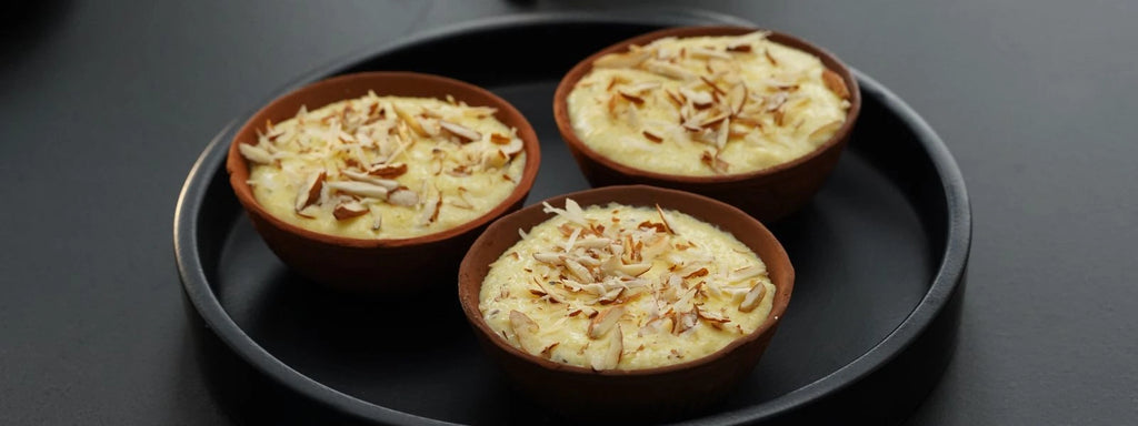 Creamy Saffron Phirni: A rich, slow-cooked rice pudding infused with cardamom, saffron, and finished with a touch of cream