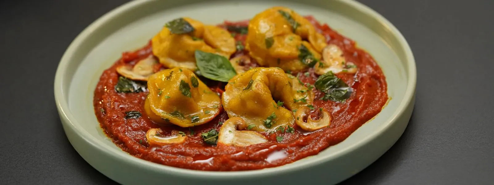 Momo Ravioli In A Spicy Marinara Sauce: A fiery fusion that turns humble dumplings into pure indulgence.
