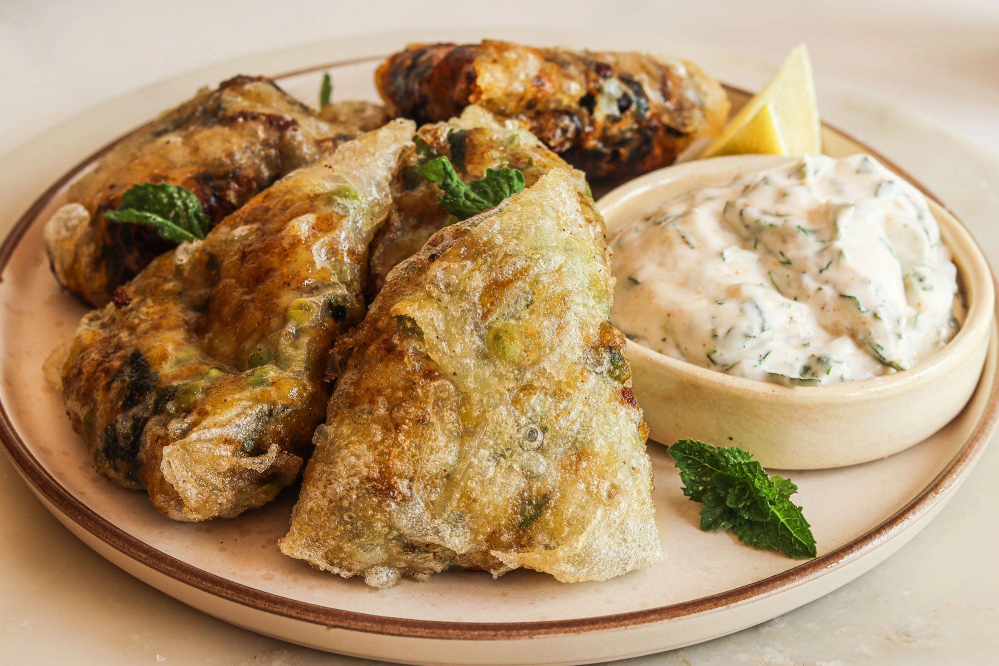 Cheesy Rice Paper Samosa: A crispy, cheesy fusion of classic samosa flavors with a modern twist.