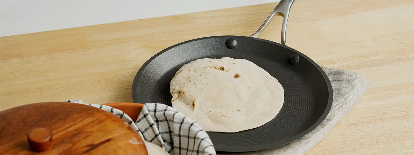 Indian iron tawa or pan to prepare chapati, roti on white