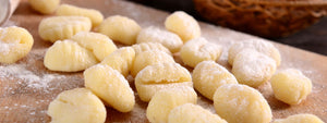 carrot gnocchi with cheese fondue and green peas